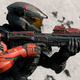 A black and red spartan holds an assault rifle and uses aim assist in Halo Infinite.